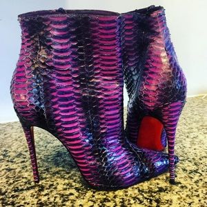 Christian Louboutin python boots.